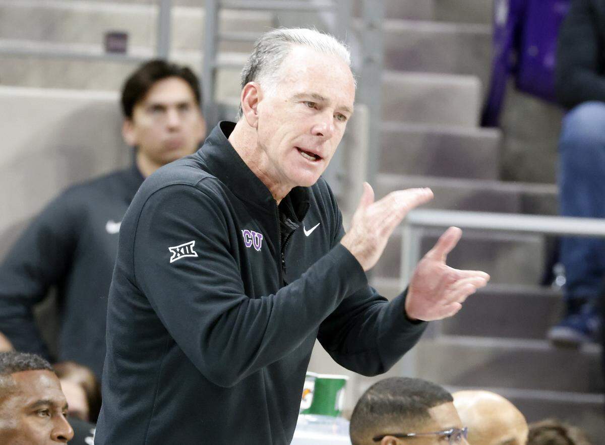 TCU head coach Jamie Dixon applauds a play against Houston during the first half of a NCAA basketball game between the University of Houston and TCU at Schollmaier Arena in Fort Worth, Texas, Wednesday Jan. 26, 2026