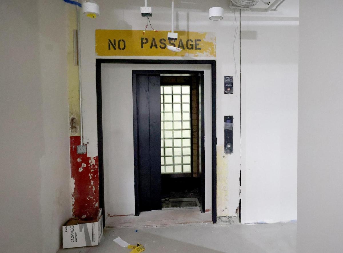 Renovations continue on the Armour building in the Fort Worth Stockyards on Friday, Dec. 6, 2024. Original details, such as the ‘no passage’ sign were kept to honor the historic building.