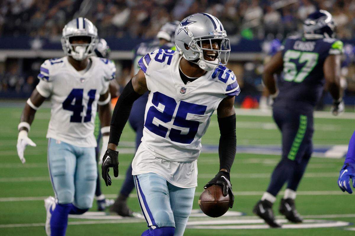 Dallas Cowboys cornerback Nahshon Wright (25) celebrates after intercepting a pass in the first half of a preseason NFL football game against the Seattle Seahawks in Arlington, Texas, Friday, Aug. 26, 2022. (AP Photo/Ron Jenkins)