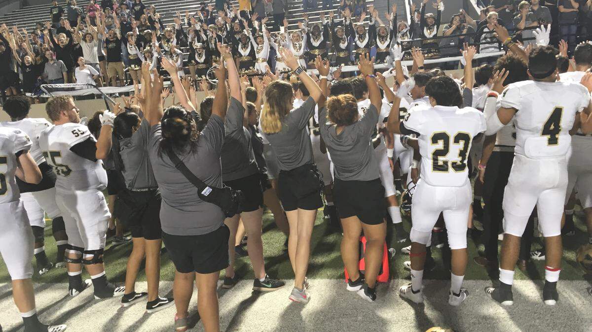 Abilene players celebrate their 28-7 victory over L.D. Bell on Friday night, Oct. 5, 2018.