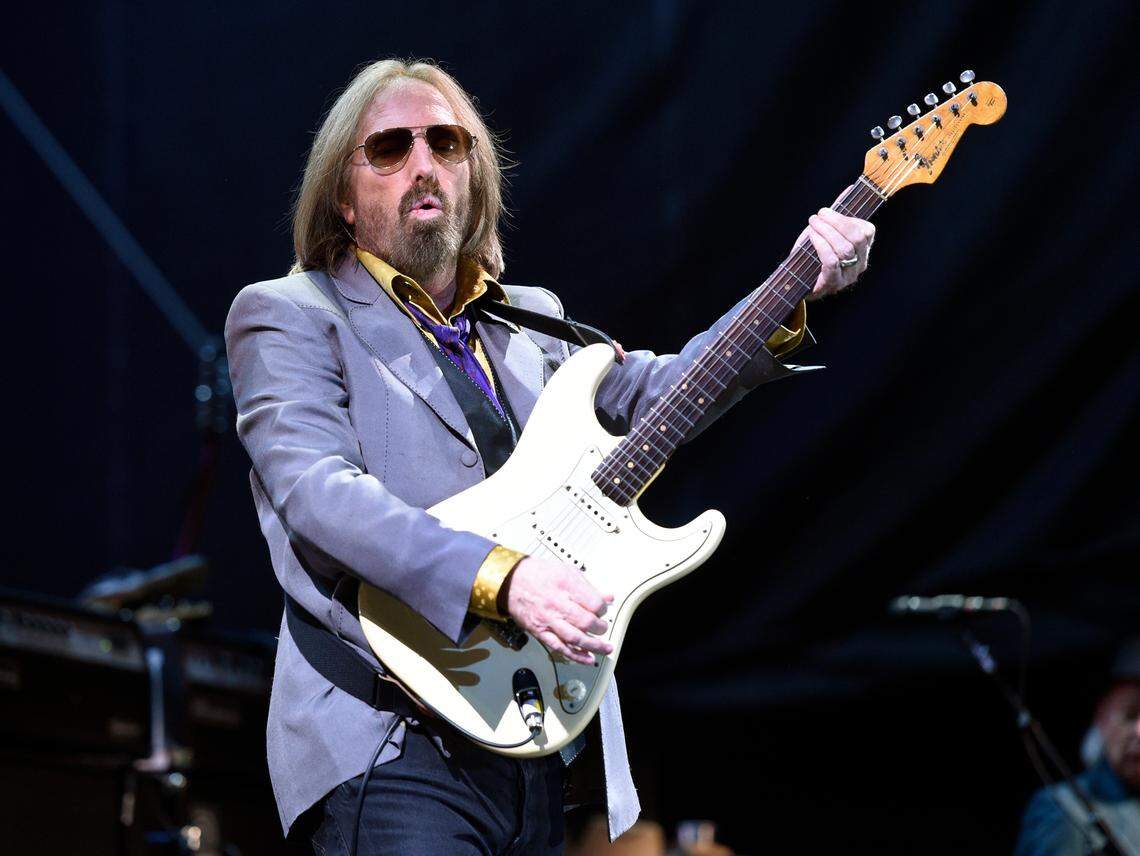 FILE - In this Saturday, June 24, 2017 file photo, Tom Petty performs with the Heartbreakers during their headlining set on Day 1 of the inaugural 2017 Arroyo Seco Music Festival, in Pasadena, Calif. Tom Petty’s family and former band members say it like therapy to compile a four-disc box set of his music. It went on sale Friday, Sept. 28, 2018 four days short of the first anniversary of his death. (Photo by Chris Pizzello/Invision/AP, File)
