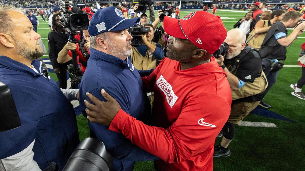 Cowboys Head Coach Mike McCarthy and Buccaneers Head Coach Todd Bowles greet each other at mid field after Dallas defeated the Bucs 26-24 at AT&T Stadium in Arlington on Sunday, Dec. 22, 2024.