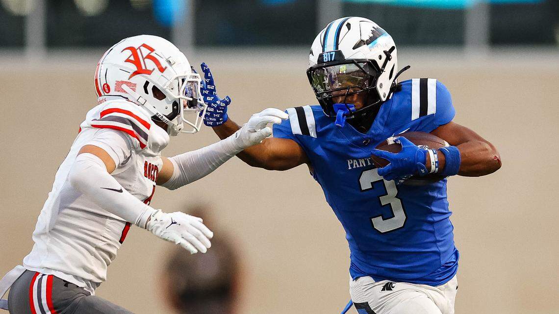 North Crowley running back G'Yrell Smith attempts to stiff-arm a Rockwall defender in a non-district game between North Crowley and Rockwall at Crowley ISD Stadium in Crowley, Texas on Sept. 18, 2025.