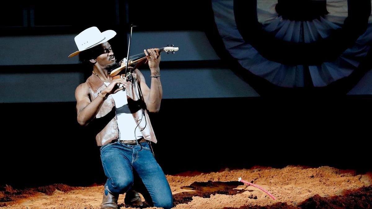 Armond Vance plays the fiddle during the Cowboys of Color Rodeo at the Fort Worth Stock Show and Rodeo at Dickies Arena on Monday. Vance, who blends genres of Hip Hop, R&B and classical, added country to the mix Monday.