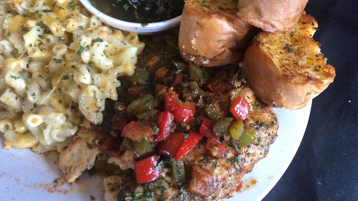 Blackened chicken with greens and mac-and-cheese at Kajunville Kitchen.