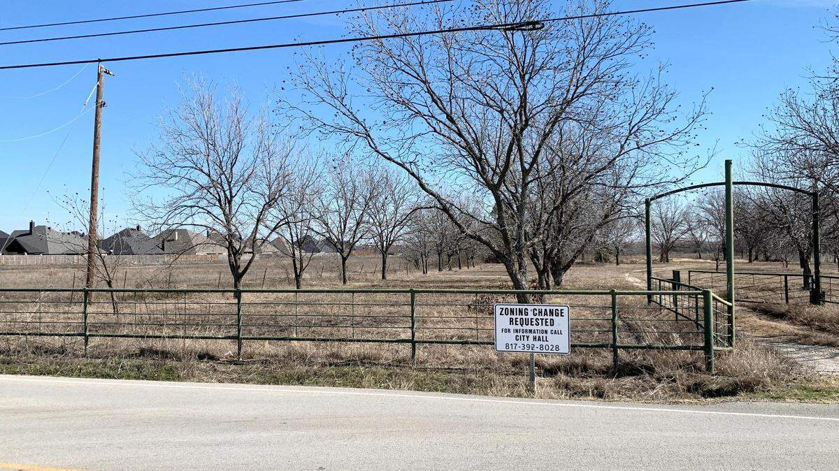 The entrance of 12650 Willow Springs Road. Haslet Investment LLC is attempting to rezone the light industrial land for residential use.