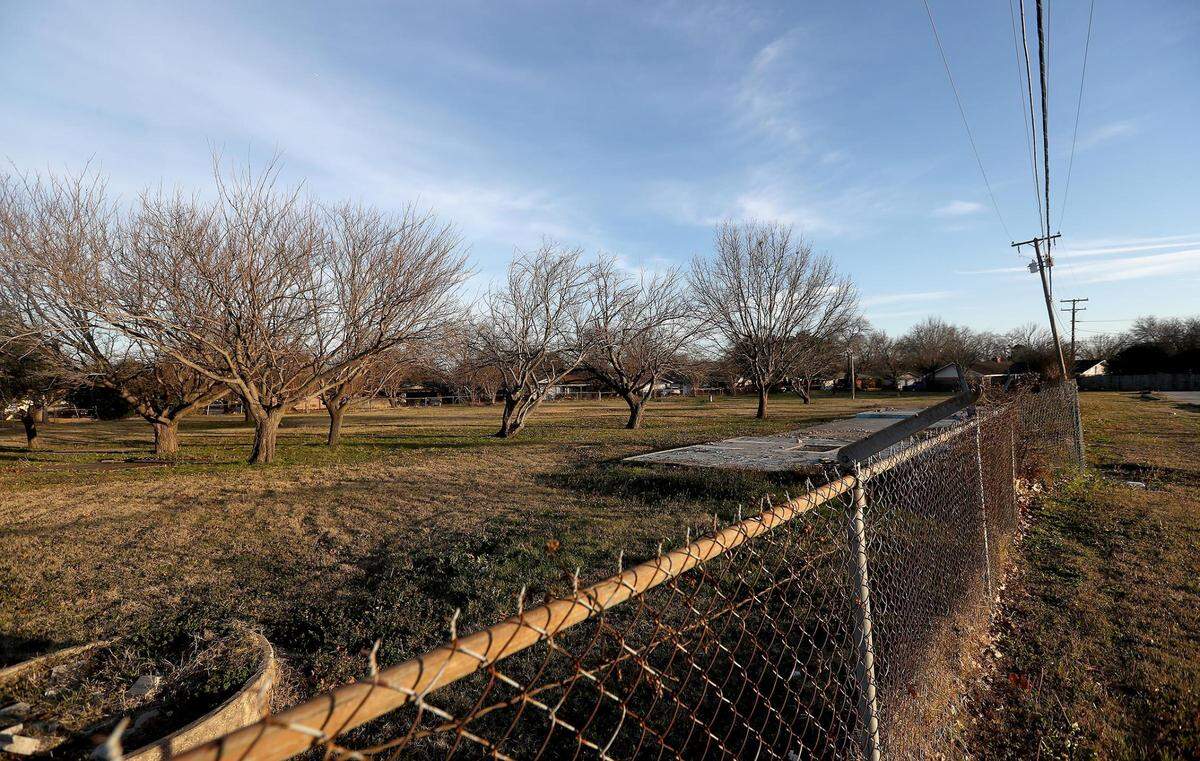 Iris Hernandez, left, and Jorge DelaTorre are working to transform a vacant lot they purchased in East Arlington into single-family homes. The couple has worked with the community and the neighborhood group East Arlington Renewal to maintain the property and learn what would be the best investment for the area.