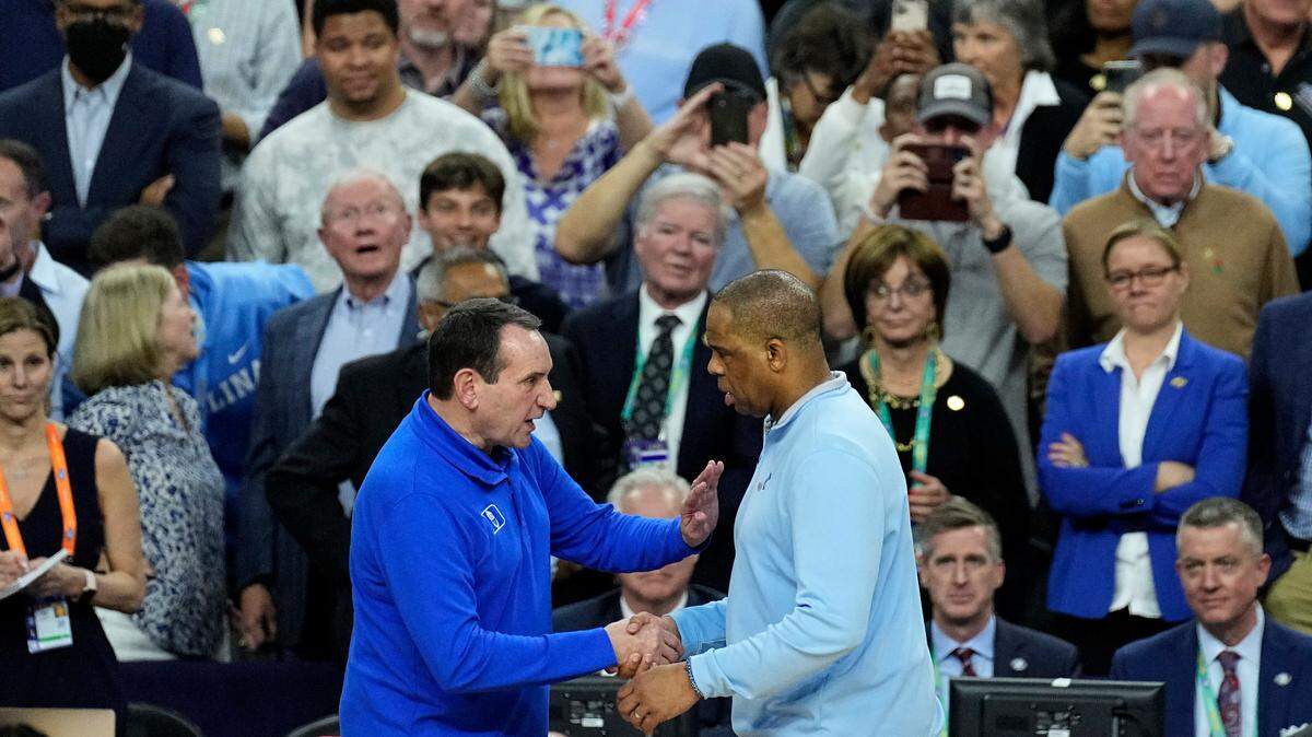 Duke head coach Mike Krzyzewski, left, shakes North Carolina head coach Hubert Davis’ hand after Duke lost in NCAA Tournament semifinals Saturday night at the Superdome in New Orleans. It was the final game of Krzyzewski’s legendary career. He announced before the season that this would be his last.