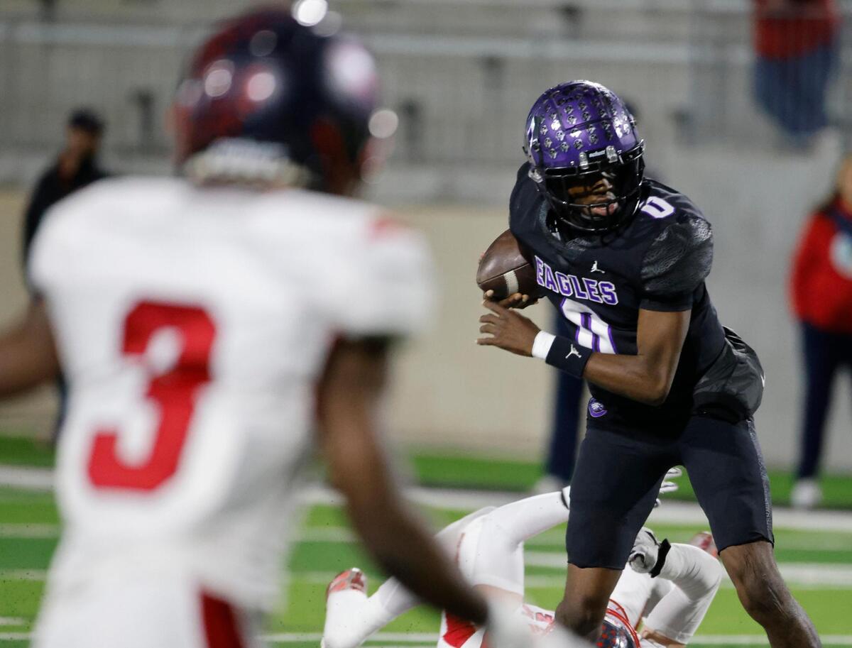 Crowley quarterback Caleb Williams (0) avoids a defender in the backfield during a UIL Class 6A D2 Bi-district playoff football game at Crowley ISD Multi-Purpose Stadium in Fort Worth, Texas, Friday, Nov. 15, 2024.