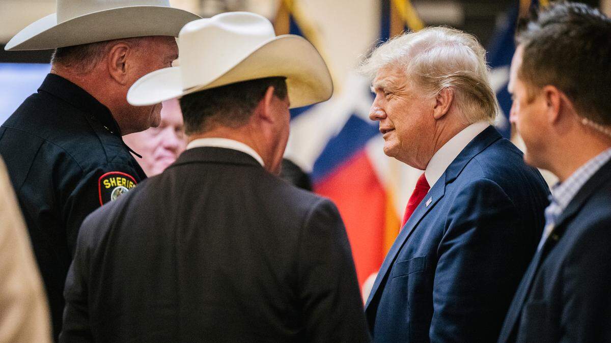 Former President Donald Trump greets Tarrant County Sheriff Bill Waybourn while arriving at a border security briefing to discuss further plans in securing the southern border wall on Wednesday, June 30, 2021, in Weslaco, Texas.
