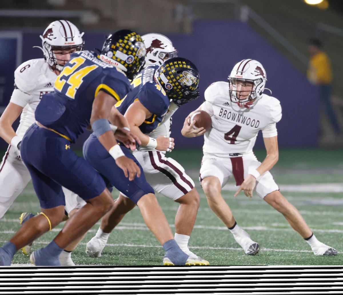 Brownwood quarterback Judson Coalson (4) cuts back to the inside during a UIL District 4-4A D1 football game at Tarleton State Memorial Stadium in Stephenville, Texas, Friday, Nov. 01, 2024.