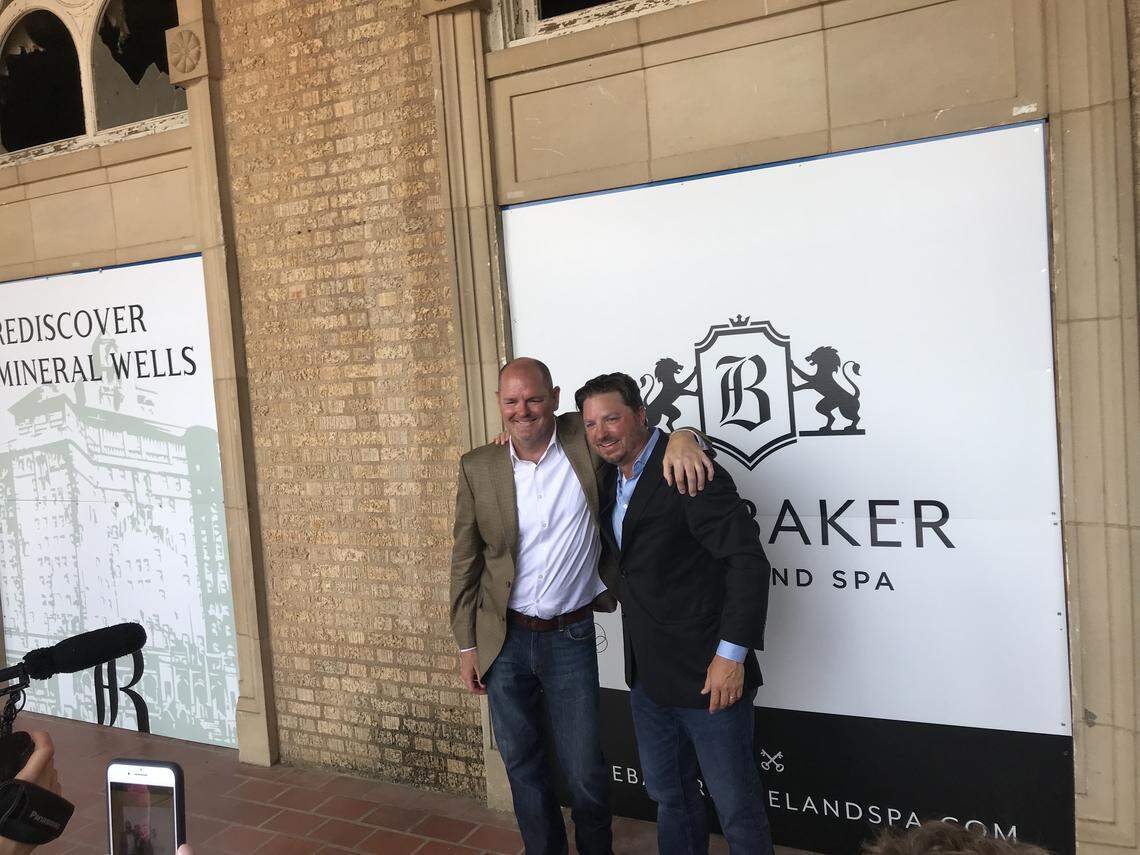 Laird Fairchild (left) and Chad Patton celebrate the announcement they have purchased the historic Baker Hotel in Mineral Wells and will start renovations immediately.