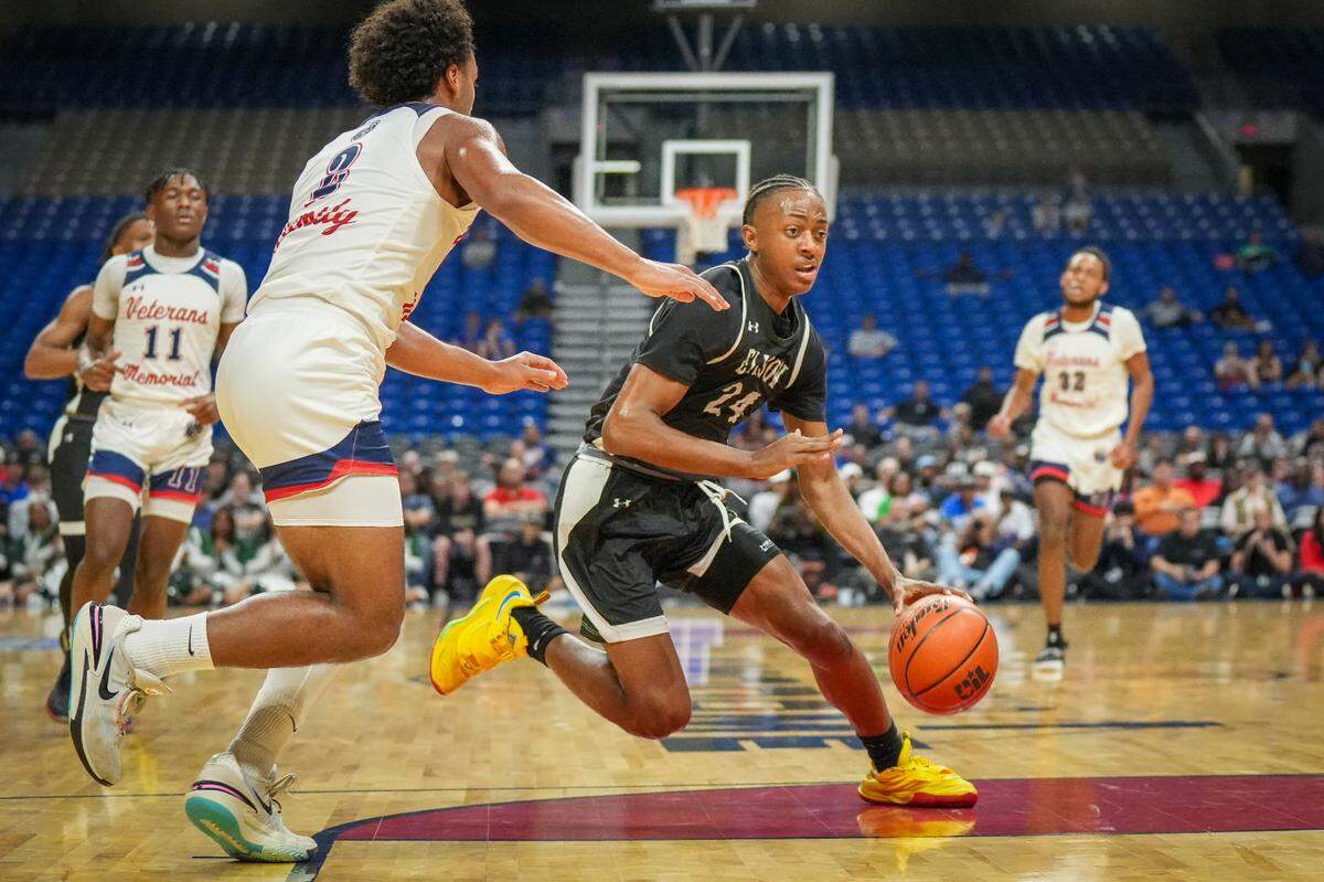 Killeen Ellison guard Ahziel McIver (24) tries to get around Devin McCloud (2) of San Antonio Veterans Memorial in a Class 5A state semifinal on Thursday, March 7, 2024 at the Alamodome in San Antonio, Texas. McIver scored a game-high 23 points as Ellison defeated Veteran’s Memorial 59-47.