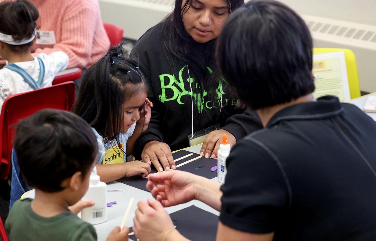 Annalee Esparza, right, and her 3-year-old daughter Sophia work together on an educational art project while attending a Zero to Five class on Wednesday, Oct. 30, at M.H. Moore Elementary School in Fort Worth.