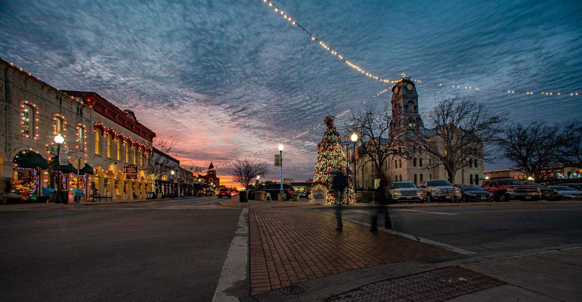 Christmas lights shine bright on the Granbury Square with the historic Hood County Courthouse, right, and the Opera House, left. Photo taken Dec. 23, 2022.