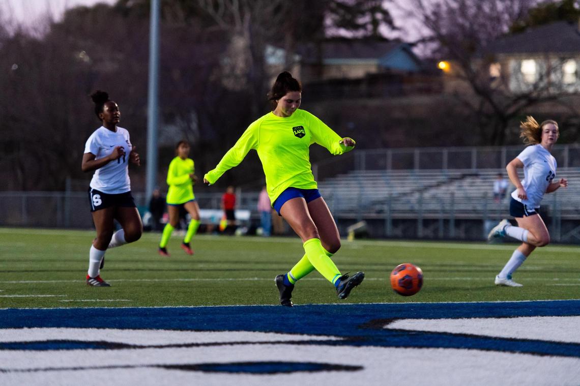 Laci Earixson kicks the ball to score her 100th career goal during a home game against All Saints on February 4, 2021. Photo by Matt Smith (Special to the Star-Telegram).