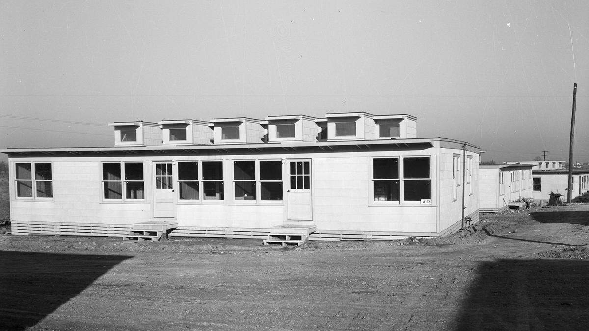 Exterior view of a Liberator Village “whites,” referring to the white asbestos siding, January 1943. These were the first housing units built to provide wartime housing for Consolidated Aircraft Corp. employees. 
