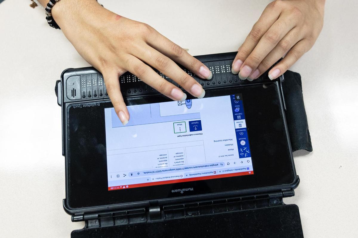 Dayanara Sanchez, 17, uses her braille Note Touch in her AP language class at Sam Houston High School in Arlington.