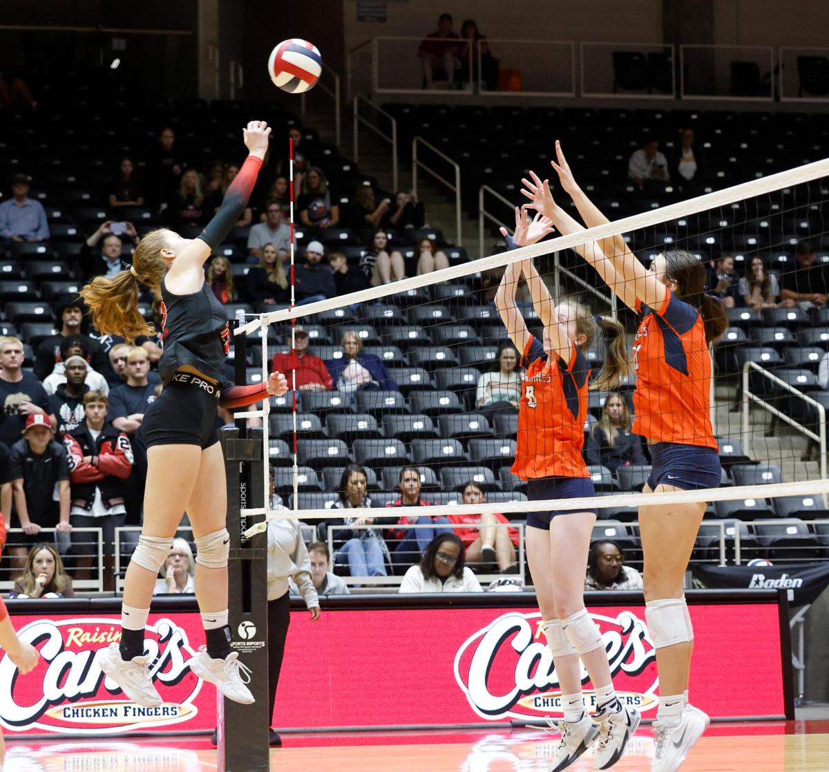 Argyle middle blocker Ella Roberts (13) returns volley during a UIL 5A D2 semifinal volleyball match at Curtis Culwell Center in Garland Texas, Tuesday, Nov. 19, 2024.