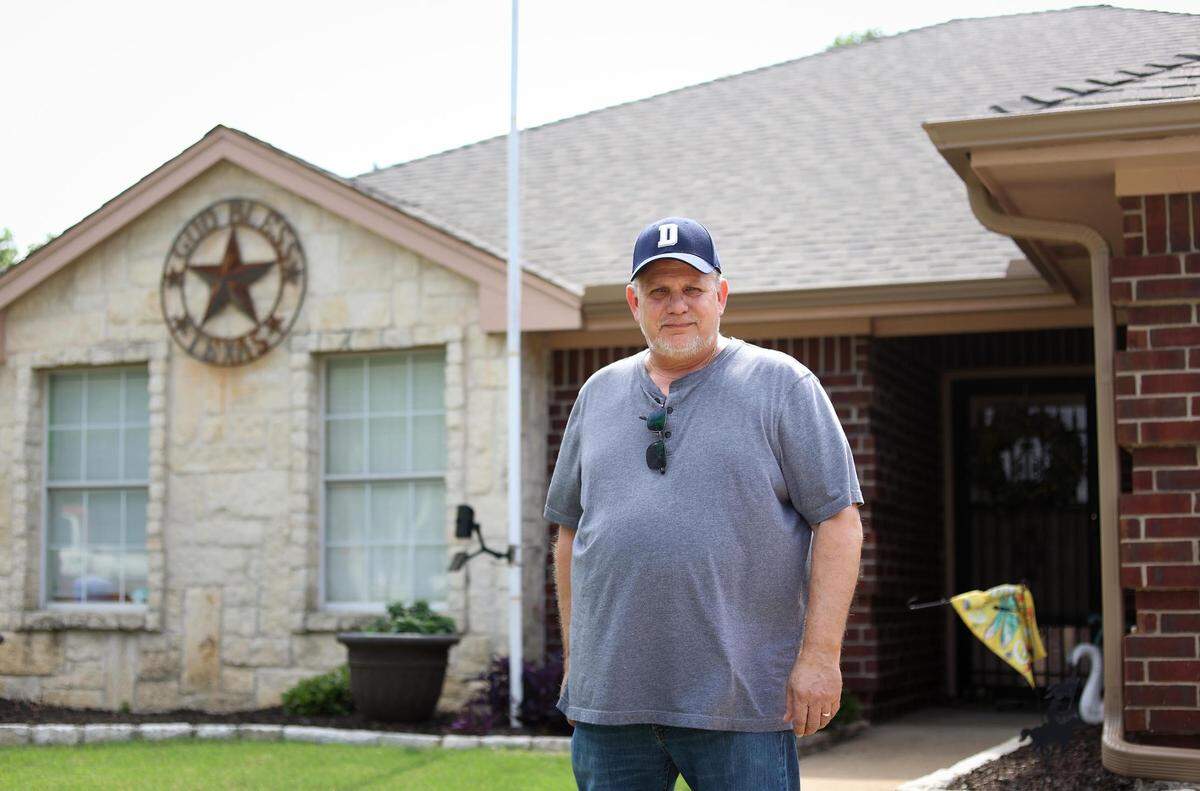 Wes Bullock, in front of his Keller home on Tuesday, says that over the past four years the appraised value of his home rose 34%, making his tax bill jump over 20%.