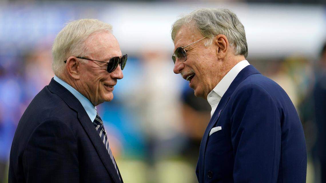Dallas Cowboys team owner Jerry Jones, left, talks with Los Angeles Rams owner Stan Kroenke, right, before an NFL football game, Sunday, Oct. 9, 2022, in Inglewood, Calif.