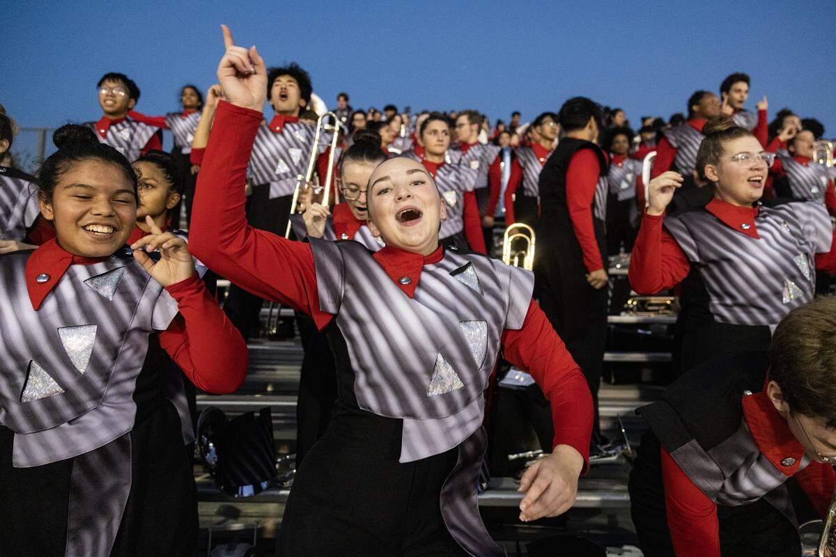 Mellophone player Serena Leffel, 16, celebrates after Trinity scored a touchdown during a high school football game against Timbercreek high school at Keller ISD Athletic Complex in Keller on Friday, Oct. 10, 2025.
