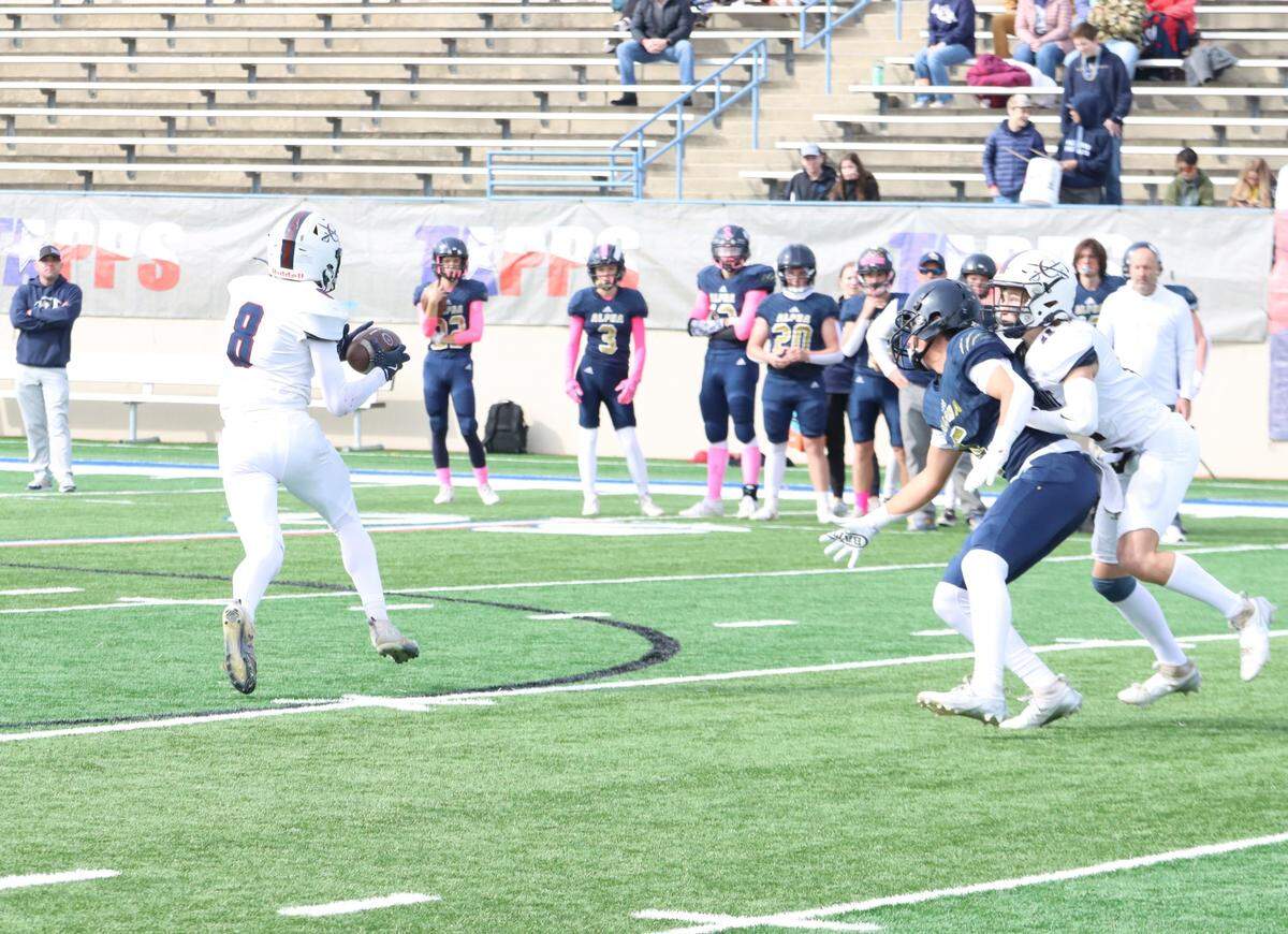 Fort Worth Covenant Classical’s Hudson Williams (8) picks off a pass and returns it 49 yards for a touchdown against Huntsville Alpha Omega in the TAPPS Six-Man Division II Championship game on Thursday, Dec. 5, 2024 at Waco ISD Stadium in Waco, Texas.