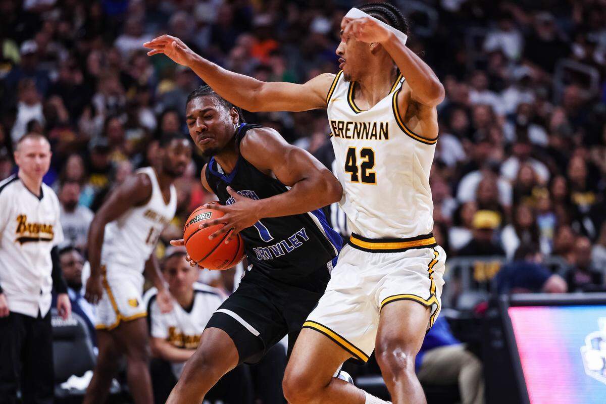 North Crowley forward Alex Barther II (1) drives with the ball as a San Antonio Brennan defender plays on his side in the Class 6A Division I state championship at The Alamodome in San Antonio, Texas, March 14, 2026.