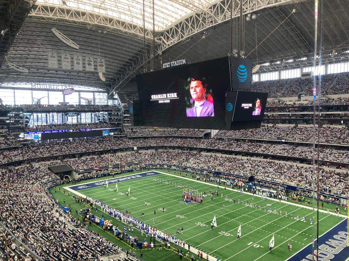 A moment of silence for conservative commentator Charlie Kirk is observed before the Dallas Cowboys’ game against the New York Giants on Sunday at AT&T Stadium.