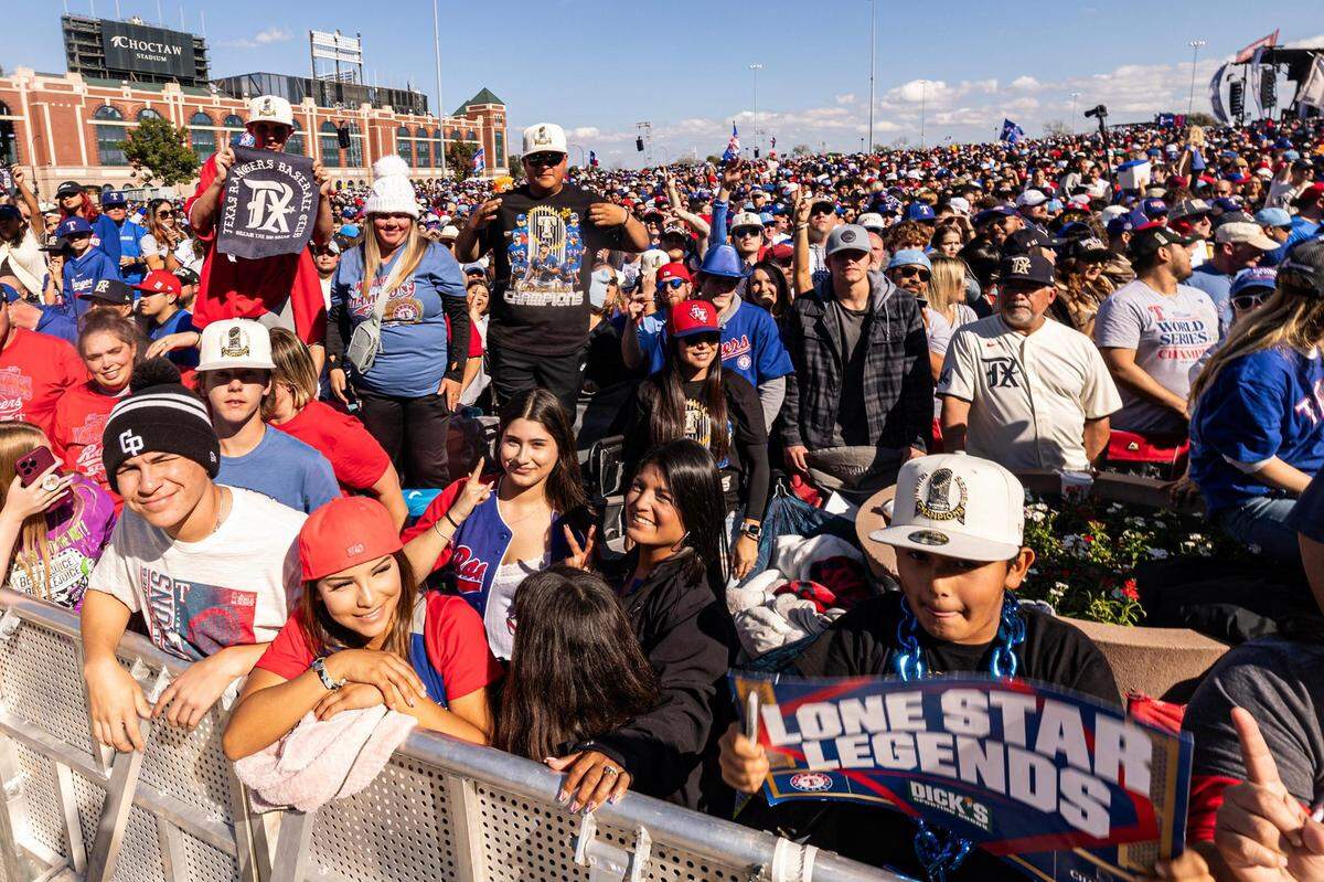 Rangers fans gather to celebrate the Texas Rangers World Series championship for the World Series Parade in front of Globe Life Field in Arlington on Friday.