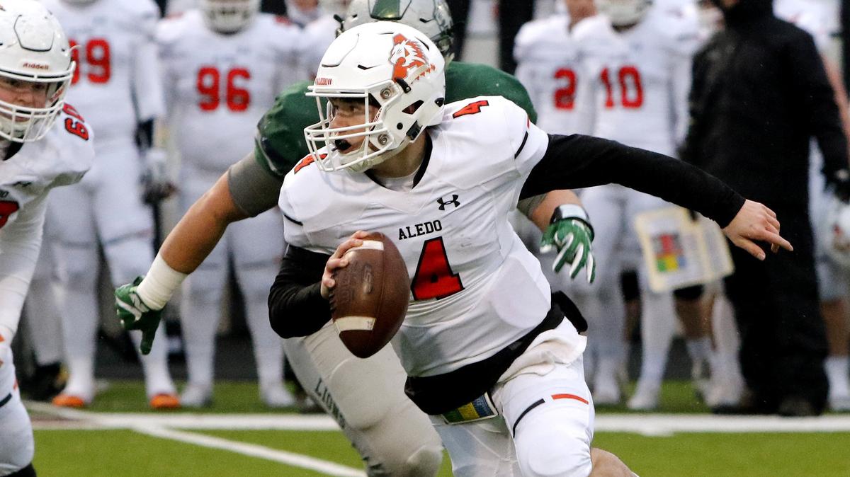 Aledo quarterback Jake Bishop (4) cuts back for short yardage in the first half of a high school 5A Division II Quarter Finals football playoff game at Northwest ISD Stadium, Justin, Texas, Saturday, Dec. 08, 2018. Aledo led 13-3 at the half. (Star-Telegram Bob Booth)