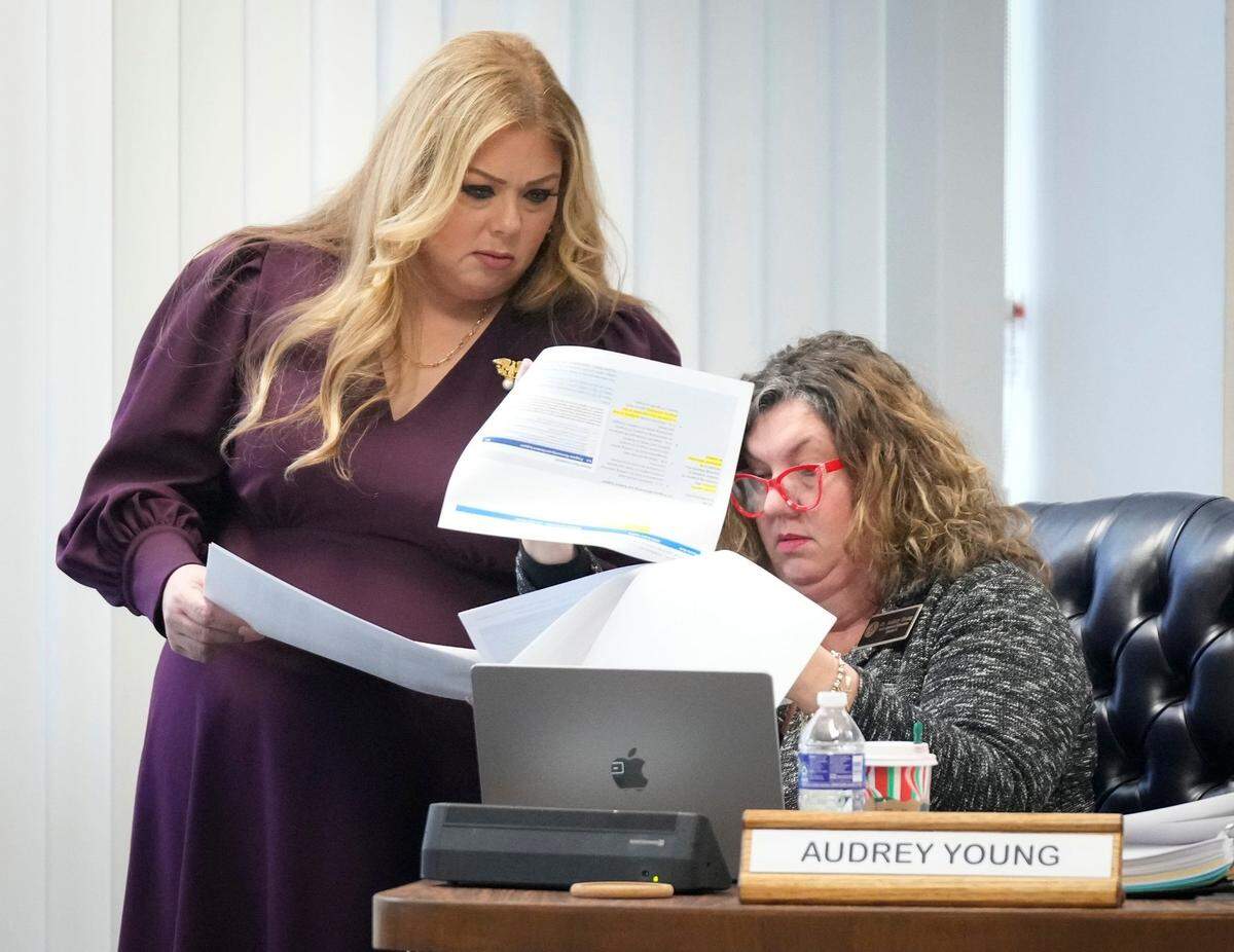 State Board of Education members Julie Pickren, left, and Audrey Young discuss the controversial Bluebonnet teaching materials at a meeting of the State Board of Education at the William B. Travis Building Friday November 22, 2024. The Bluebonnet materials, which use Bible stories, are K-5 math and reading instructional materials that the 2023 House Bill 1605 mandated the Texas Education Agency created with the intention of creating high quality instructional resources for teachers.