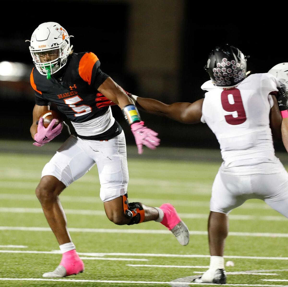 Aledo running back Ryan Williams (5) avoids the tackle of Timberview outside linebacker Zachary Essih (9) in a high school district 5-5A division 2 football game at Bearcat Stadium in Aledo, Texas, Friday Oct. 15, 2021. Aledo defeated Timberview 35-21. (Special to the Star-Telegram Bob Booth)
