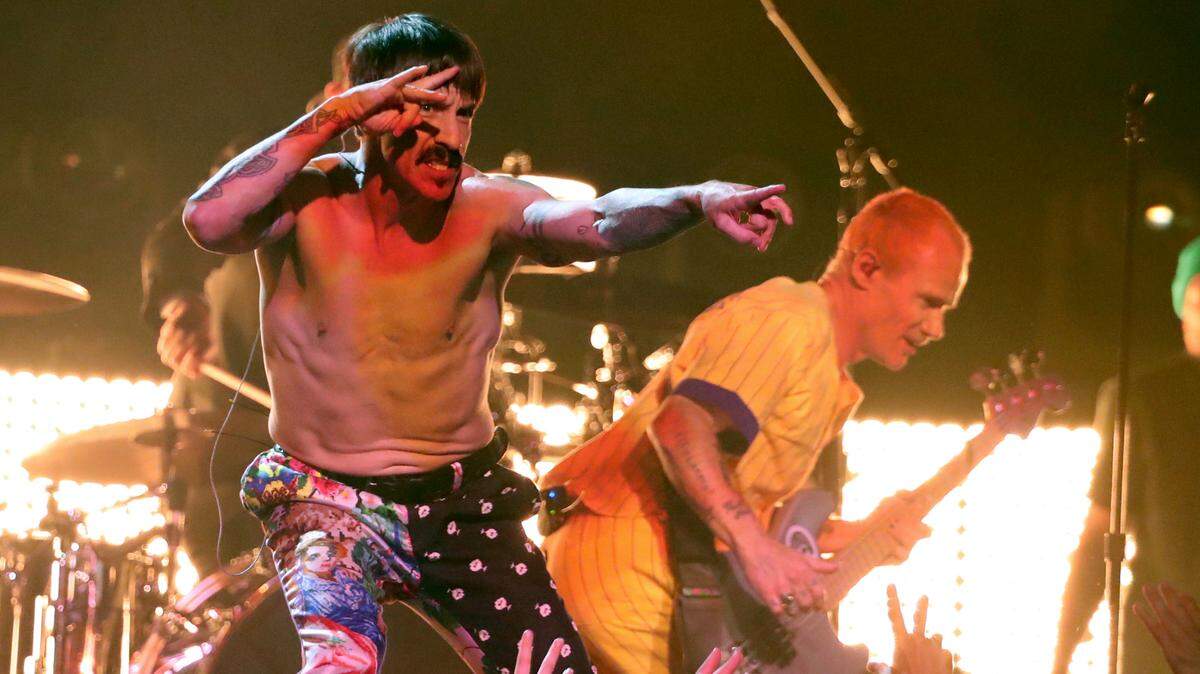 Anthony Kiedis, left, of Red Hot Chili Peppers, with bassist Flea, will close out their 2022 North American tour with a show at Globe Life Field on Sept. 18.