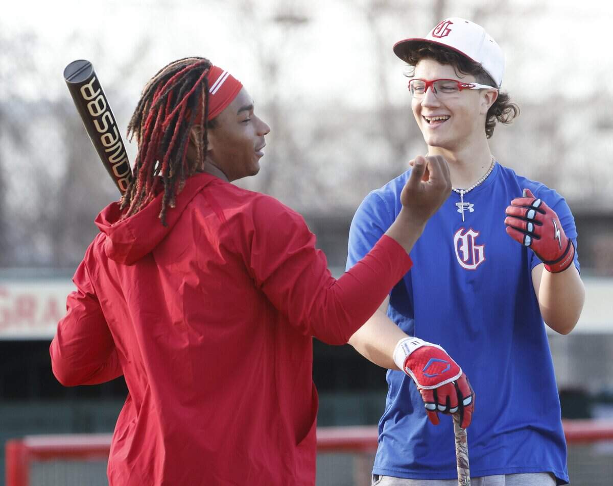 Javoeskie Lane and Luke Esquivel share a laff during Grapevine Mustang baseball practice at Grapevine High School in Grapevine, Texas, Tuesday Feb. 17, 2026.