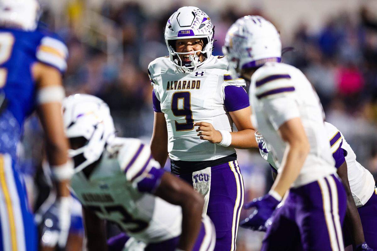 Alvarado quarterback KJ Jenkins yells toward his offensive linemen before taking the snap in a Class 4A Division I area playoff game against Sulphur Springs on Friday, Nov. 21, 2025, at Children’s Health Stadium in Prosper, Texas.