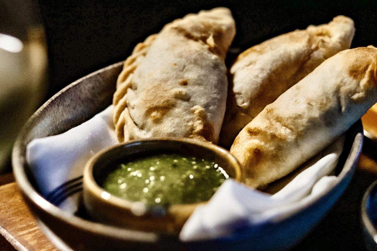 Empanadas are on the appetizer menu at Tinie’s.