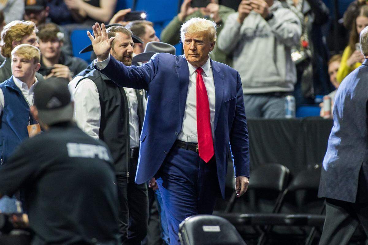 Mar 18, 2023; Tulsa, OK, USA; Former President Donald Trump waves to the crowd March 18 before the NCAA D1 Wrestling Championships in Oklahoma. (Brett Rojo-USA TODAY Sports)