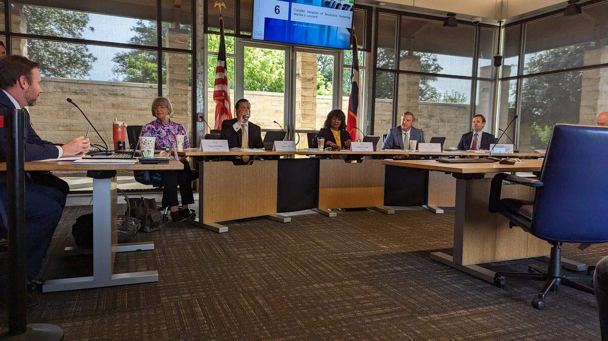 A TRWD board meeting with all the members of the five person board sitting on a dais looking towards the camera