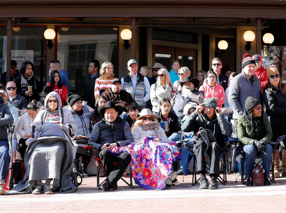 Fans bundled up during the 2023 Fort Worth Stock Show and Rodeo parade in downtown Fort Worth on Saturday.