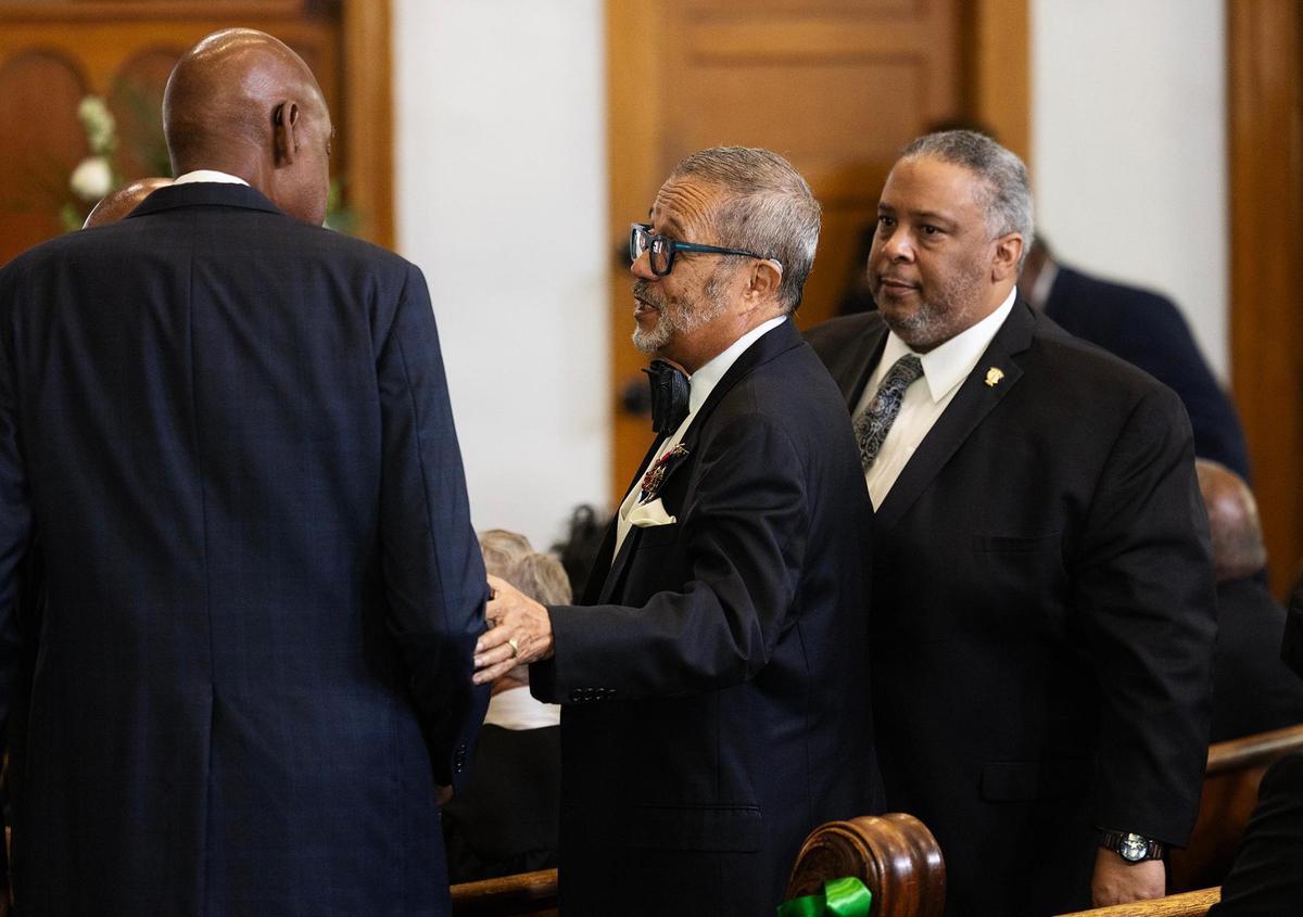 Former Tarrant County Commissioner Roy Brooks, center, attends the funeral for Judge Clifford Davis on Tuesday, Feb. 25, at Saint Andrews United Methodist Church in Fort Worth.