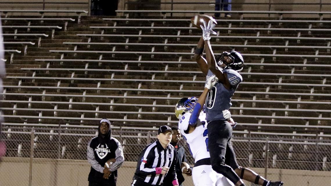 South Hills wide receiver Dejuan Jones (10) goes up for the reception defended by Boswell running back Camron Hurst (26) to put South Hills within 3 during the second half of a high school football game at Clark Stadium Thursday, Oct. 25, 2018. Boswell defeated South Hills 33-30. (Special to the Star-Telegram Bob Booth)