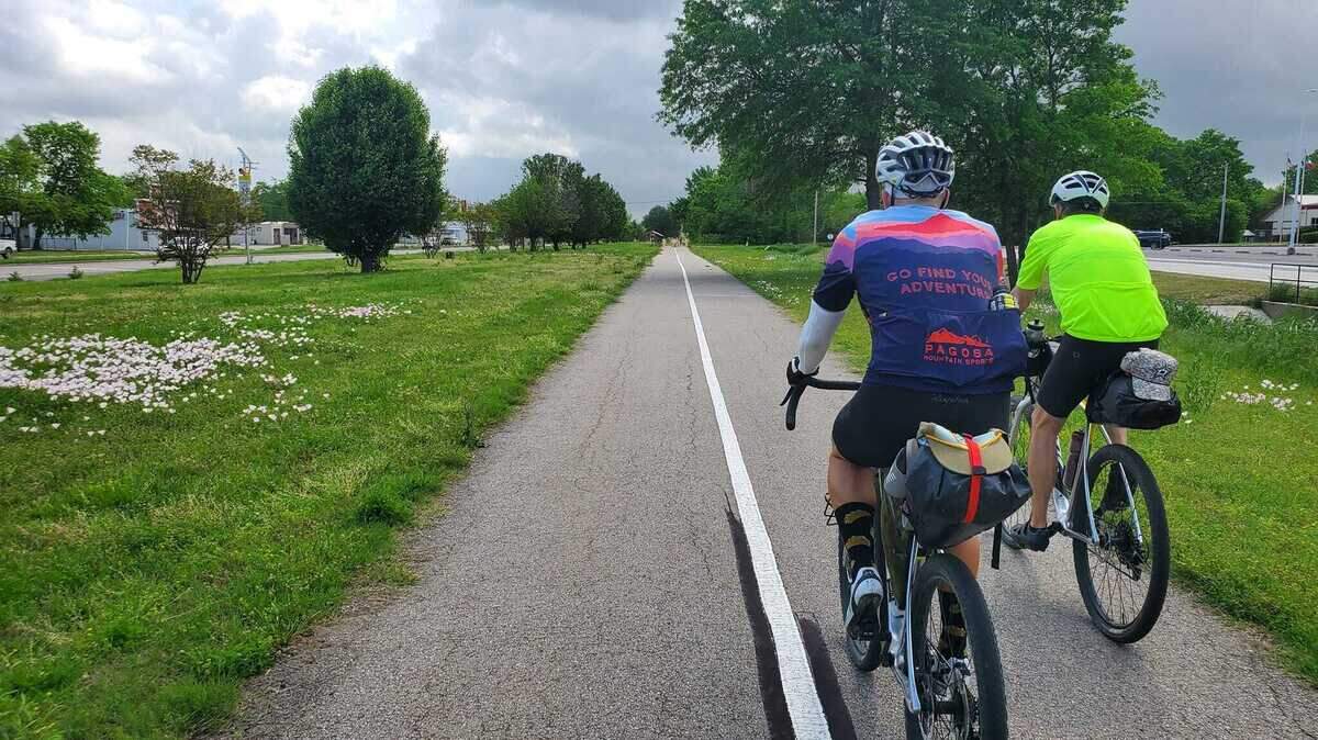 In this spring 2022 photo, Paul Rust and Tod Douglas ride on a paved section of the Northeast Texas Trail, between Paris and Blossom. The NETT has a wide variety of trail conditions across its 133-mile length.