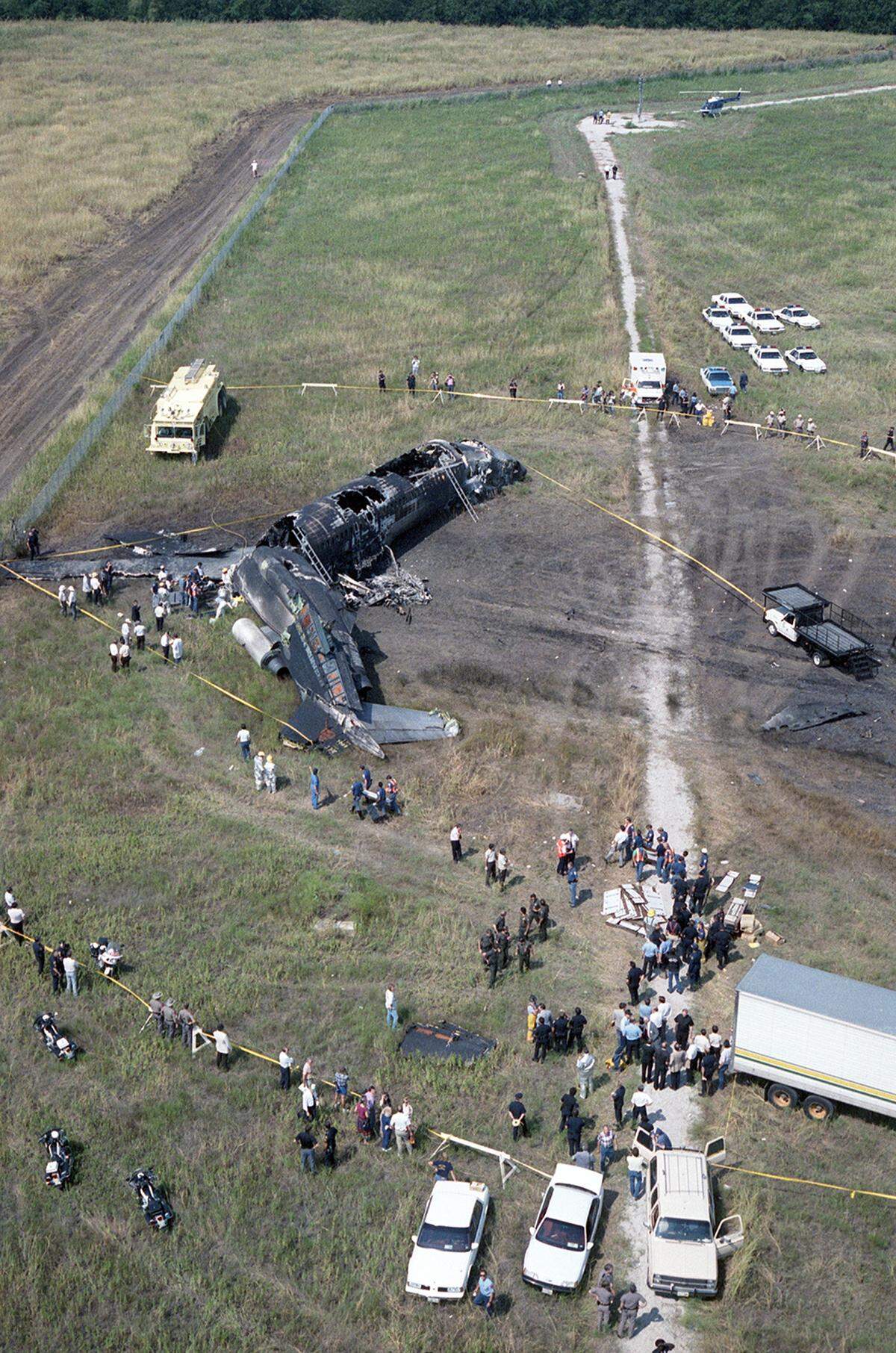Aug. 31, 1988: Aerial view of the Delta Flight 1141 crash at Dallas-Fort Worth International Airport. The deceased were placed in a makeshift morgue transport truck, set up on site by the Tarrant County Medical Examiner’s Office. Twelve passengers and two crew members perished.