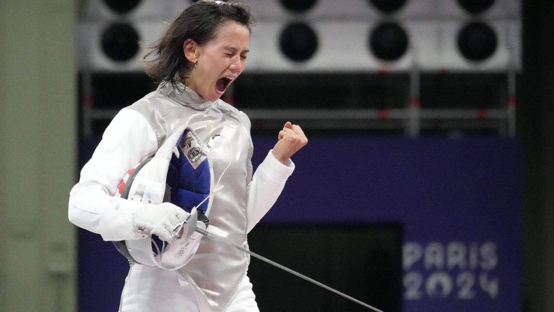 American fencer Lee Kiefer celebrates defeating Martyna Jelinska of Poland during the 2024 Summer Olympics in Paris.