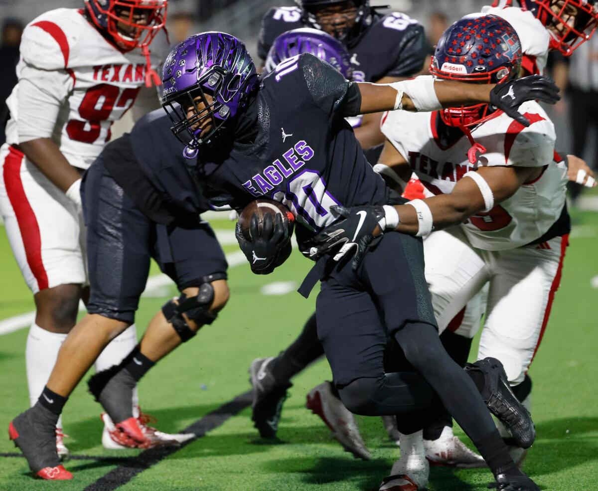Crowley quarterback Zamarian Burton (10) gains yardage around the left side during a UIL Class 6A D2 Bi-district playoff football game at Crowley ISD Multi-Purpose Stadium in Fort Worth, Texas, Friday, Nov. 15, 2024.