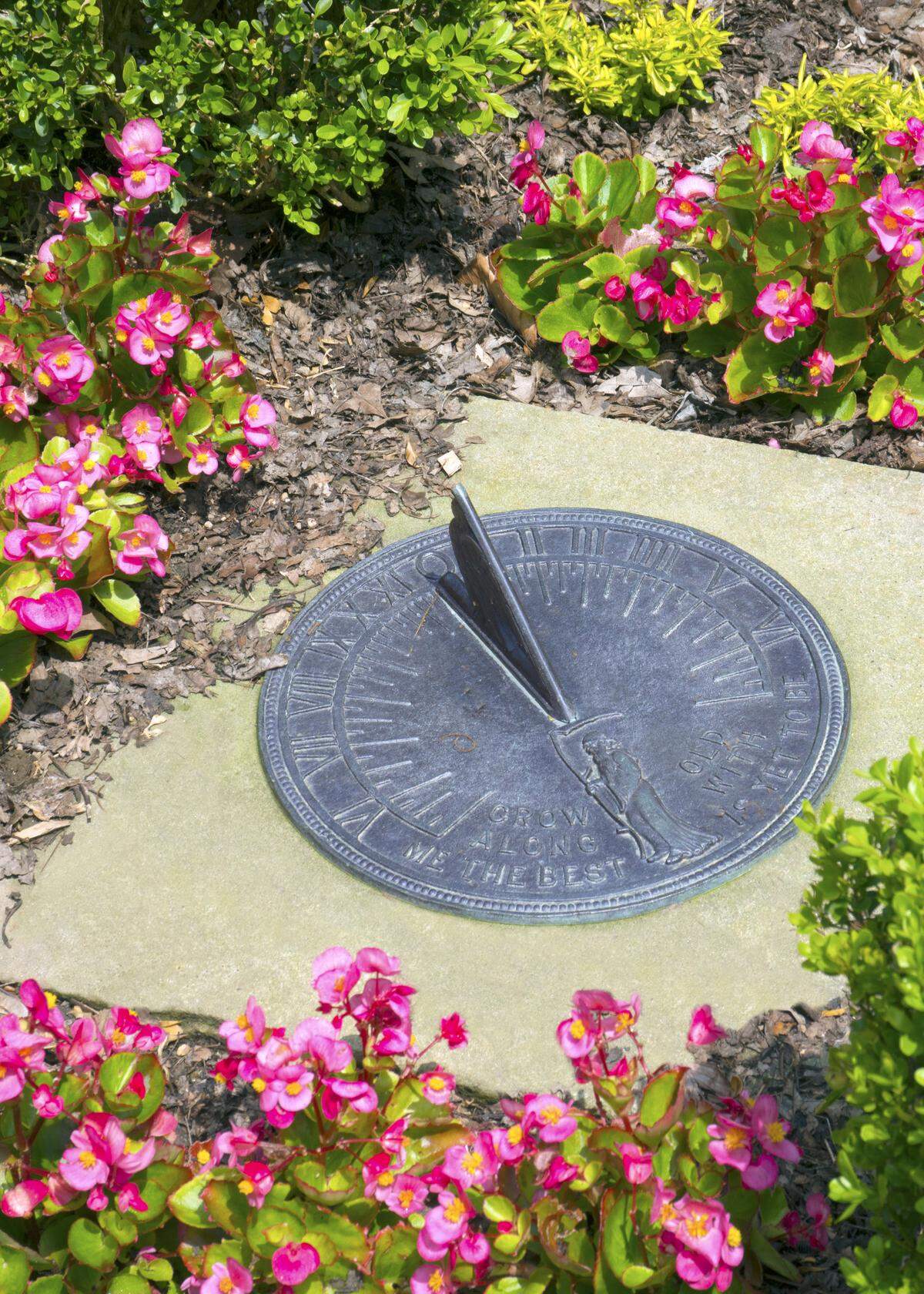 Garden art can be as simple as a sundial at ground level.