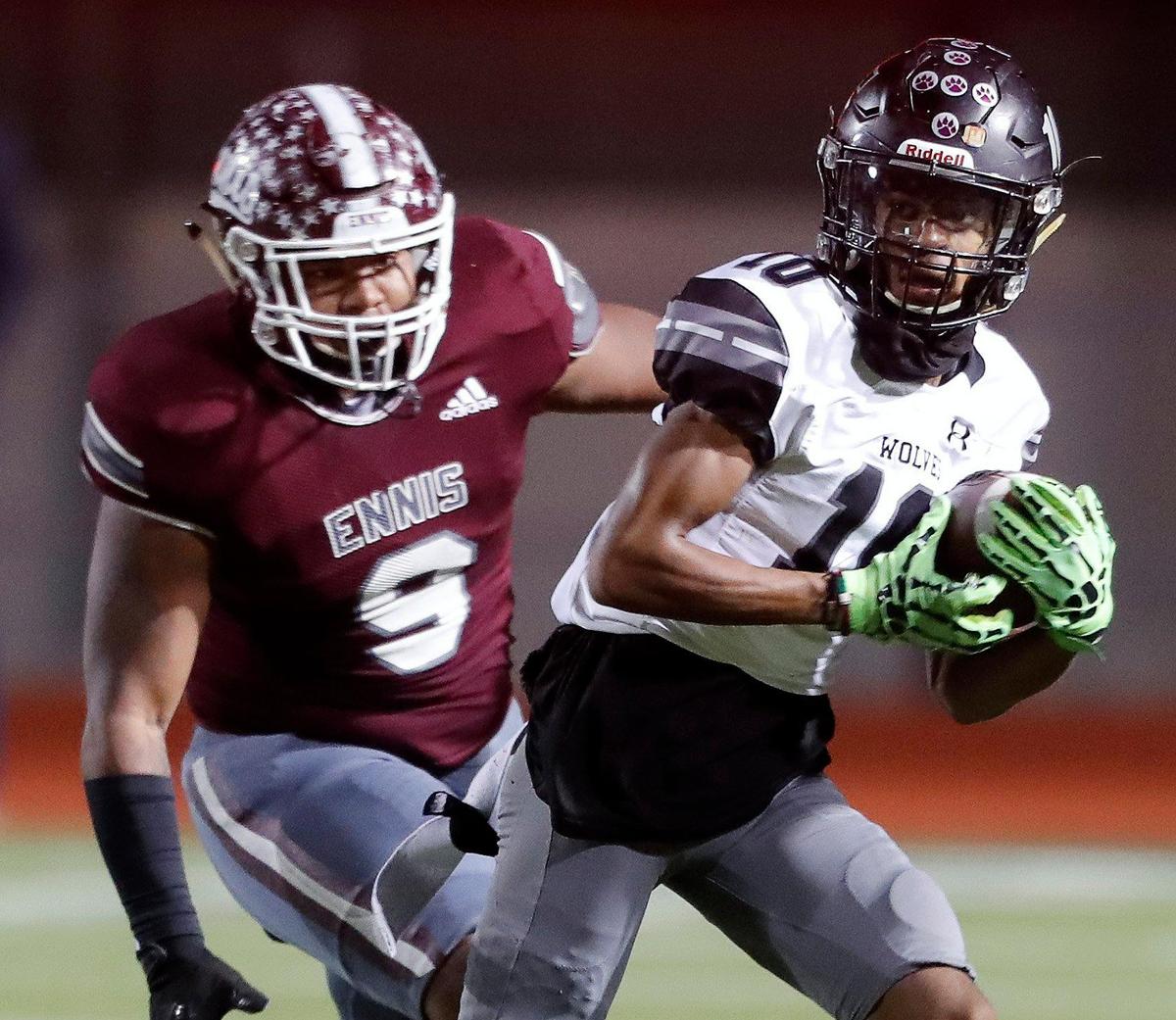 Timberview wide receiver Cemarion Chambliss (10) outruns Ennis defensive lineman Lazarus Becks (9) after a catch in a class 5A Division 2 area round football playoff game at Lumpkins Stadium in Waxahachie, Texas, Friday Nov. 19, 2021. Timberview led 21-14 at the half.(Special to the Star-Telegram Bob Booth)