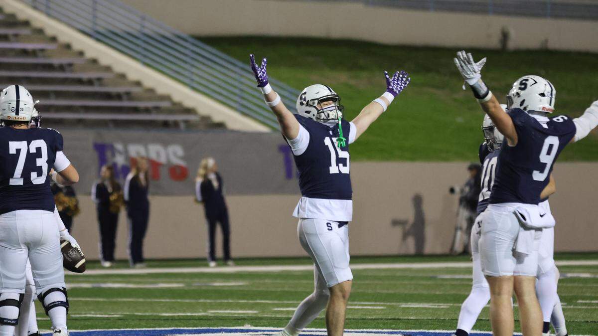 Fort Worth All Saints tight end Jake Powers (middle) throws his arms up in celebration as All Saints wins the TAPPS Division II state championship Friday in Waco.