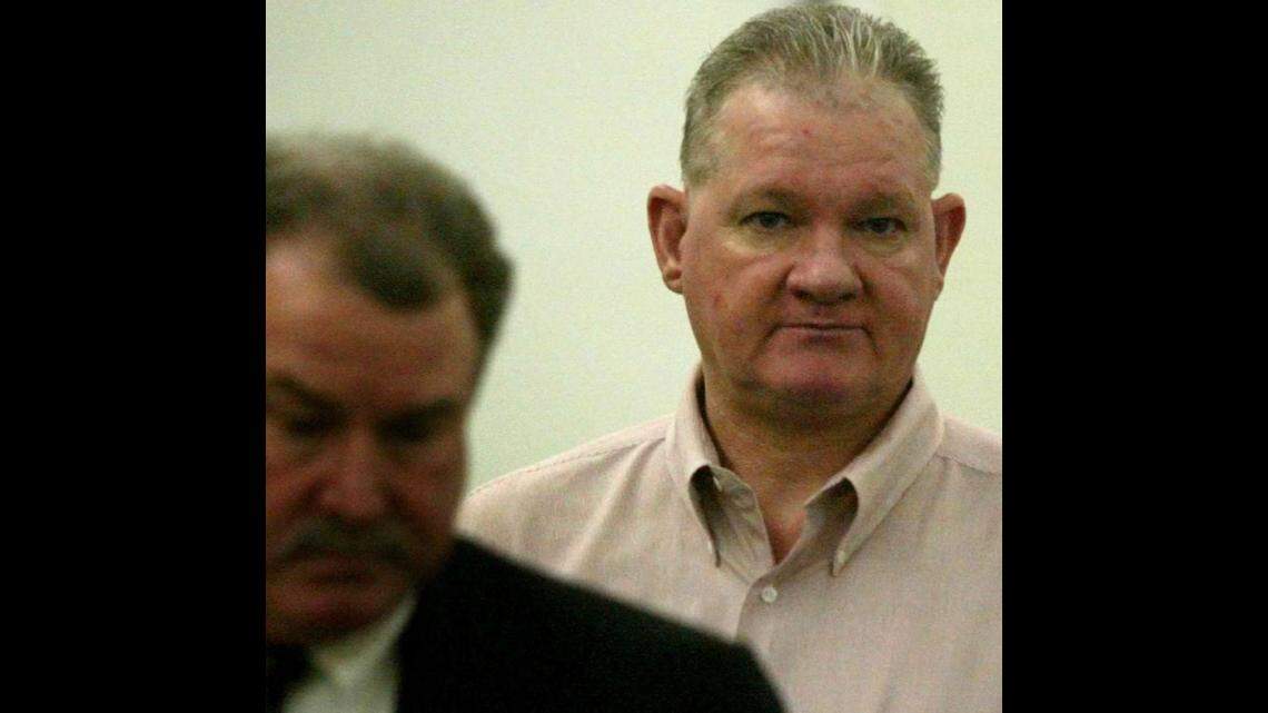 Billy Jack Crutsinger (right) follows a defense attorney into court at the Tarrant County Justice Center in Fort Worth, Texas Monday September 22, 2003. Crutsinger was convicted of killing an elderly mother and daughter who had given him work at their Meadowbrook home.
